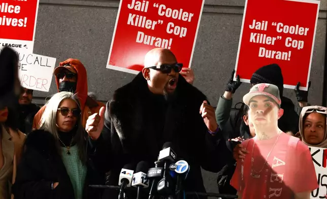 Hawk Newsome speaks accompanied by Gretchen Sotoaw, the mother of Eric Duprey, outside the Bronx Criminal Court in New York, Friday, Feb. 6, 2026, after New York police officer Erik Duran who was convicted of manslaughter after he tossed a picnic cooler filled with drinks at a fleeing Duprey, causing him to fatally crash his motorized scooter. (AP Photo/Kena Betancur)