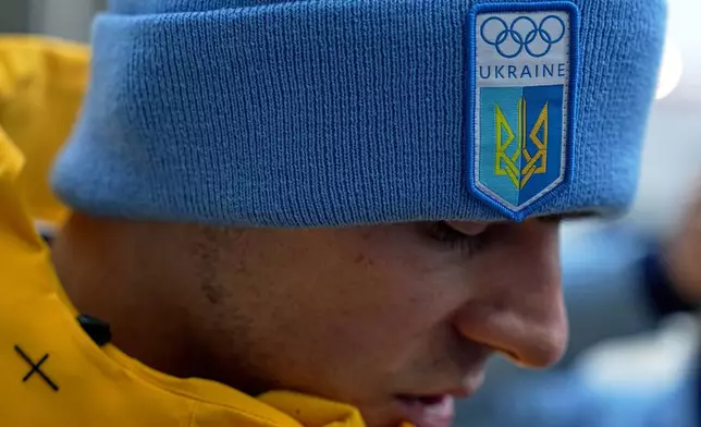 Ukrainian skeleton athlete Vladyslav Heraskevych talks to the media at the start house of the sliding center at the 2026 Winter Olympics, in Cortina d'Ampezzo, Italy, Thursday, Feb. 12, 2026. (AP Photo/Fatima Shbair)