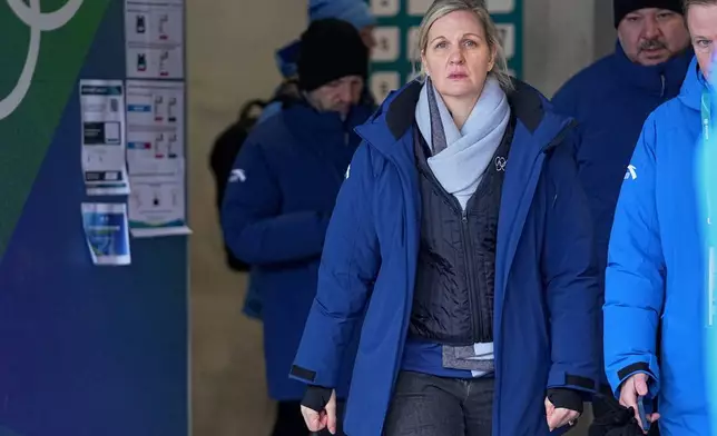International Olympic Committee President Kirsty Coventry leaves the start house of the sliding center at the 2026 Winter Olympics, in Cortina d'Ampezzo, Italy, Thursday, Feb. 12, 2026. (AP Photo/Fatima Shbair)