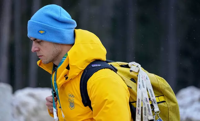 Ukrainian skeleton athlete Vladyslav Heraskevych walks next to the start house of the sliding center at the 2026 Winter Olympics, in Cortina d'Ampezzo, Italy, Thursday, Feb. 12, 2026. (AP Photo/Fatima Shbair)