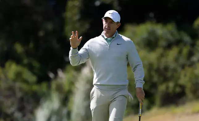 Rory McIlroy, from Northern Ireland, waves after putting on the fourth hole during the second round of the Genesis Invitational golf tournament at Riviera Country Club, Friday, Feb. 20, 2026, in the Pacific Palisades area of Los Angeles. (AP Photo/Caroline Brehman)