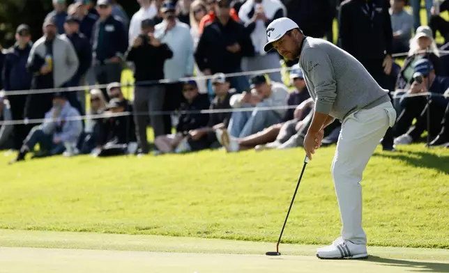 Xander Schauffele putts on the 18th hole during the second round of the Genesis Invitational golf tournament at Riviera Country Club, Friday, Feb. 20, 2026, in the Pacific Palisades area of Los Angeles. (AP Photo/Caroline Brehman)
