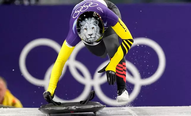 Belgium's Kim Meylemans starts for a women's skeleton run at the 2026 Winter Olympics, in Cortina d'Ampezzo, Italy, Friday, Feb. 13, 2026. (AP Photo/Aijaz Rahi)