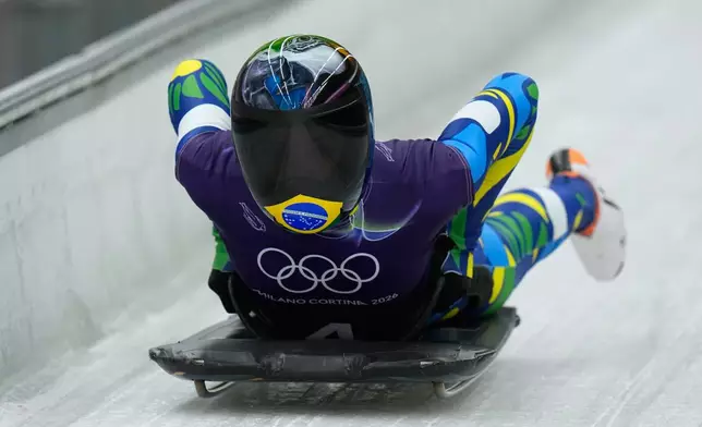 Brasil's Nicole Rocha Silveira arrives at the finish during a women's skeleton training session at the 2026 Winter Olympics, in Cortina d'Ampezzo, Italy, Tuesday, Feb. 10, 2026. (AP Photo/Alessandra Tarantino)