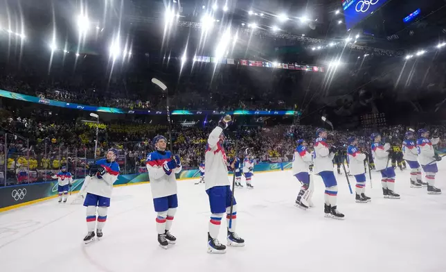 Slovakia applaud fans at the end of a preliminary round match of men's ice hockey between Sweden and Slovakia at the 2026 Winter Olympics, in Milan, Italy, Saturday, Feb. 14, 2026. (AP Photo/Petr David Josek)