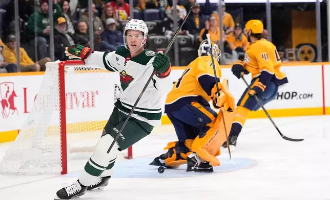 Minnesota Wild left wing Matt Boldy (12) celebrates his goal during the first period of an NHL hockey game against the Nashville Predators, Wednesday, Feb. 4, 2026, in Nashville, Tenn. (AP Photo/George Walker IV)