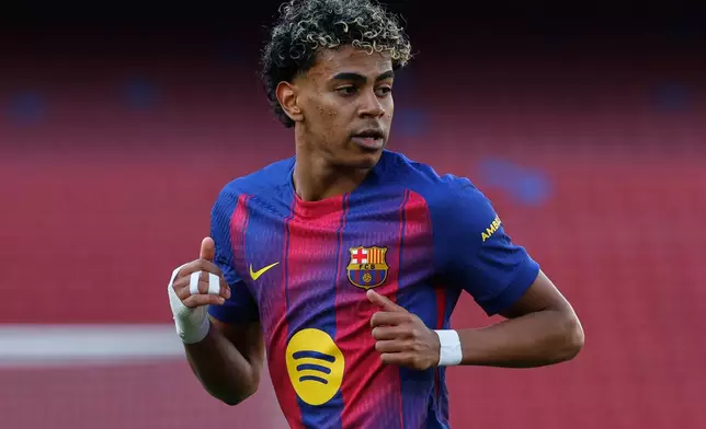 Barcelona's Lamine Yamal runs during a La Liga soccer match between Barcelona and Levante in Barcelona, Spain, Sunday, Feb. 22, 2026. (AP Photo/Joan Monfort)