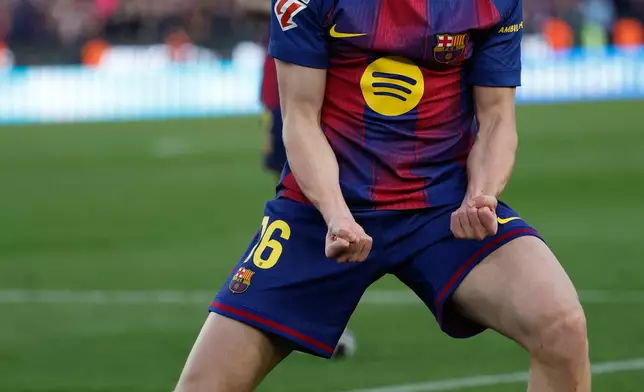 Barcelona's Fermin Lopez celebrates after scoring during a La Liga soccer match between Barcelona and Levante in Barcelona, Spain, Sunday, Feb. 22, 2026. (AP Photo/Joan Monfort)