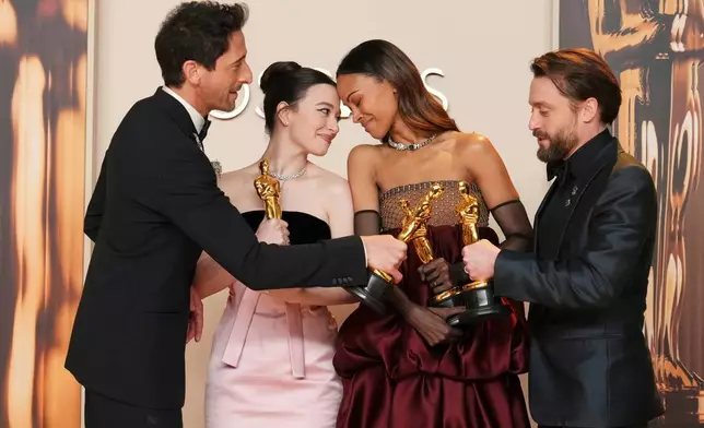 FILE - Adrien Brody, from left, winner of the award for best performance by an actor in a leading role for "The Brutalist," Mikey Madison, winner of the award for best performance by an actress in a leading role for "Anora," Zoe Saldana, winner of the award for best performance by an actress in a supporting role for "Emilia Perez," and Kieran Culkin, winner of the award for best performance by an actor in a supporting role for "A Real Pain," pose in the press room at the Oscars in Los Angeles on March 2, 2025. (Photo by Jordan Strauss/Invision/AP File)