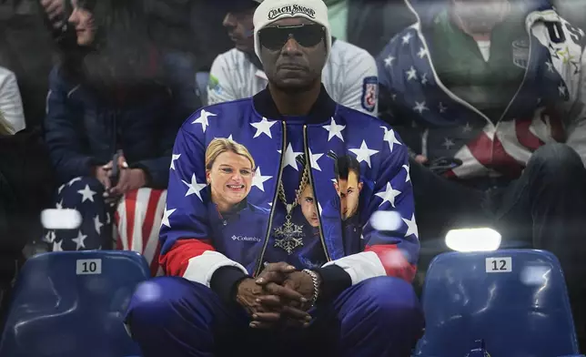 Rapper Snoop Dogg attends the mixed doubles round robin phase of the curling competition between the United States and Canada at the 2026 Winter Olympics, in Cortina d'Ampezzo, Italy, Friday, Feb. 6, 2026. (AP Photo/Fatima Shbair)