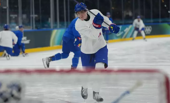 United States' Tage Thompson watches his shot during men's ice hockey practice at the 2026 Winter Olympics, in Milan, Italy, Sunday, Feb. 8, 2026. (AP Photo/Carolyn Kaster)