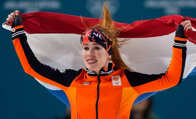 Antoinette Rijpma-de Jong of the Netherlands celebrates winning the gold medal on the women's 1500 meters speedskating race at the 2026 Winter Olympics, in Milan, Italy, Friday, Feb. 20, 2026. (AP Photo/Ben Curtis)