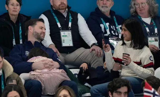 U.S. Vice President JD Vance and his wife Usha watch the men's 5,000 meters speedskating race at the 2026 Winter Olympics, in Milan, Italy, Sunday, Feb. 8, 2026. (AP Photo/Luca Bruno)