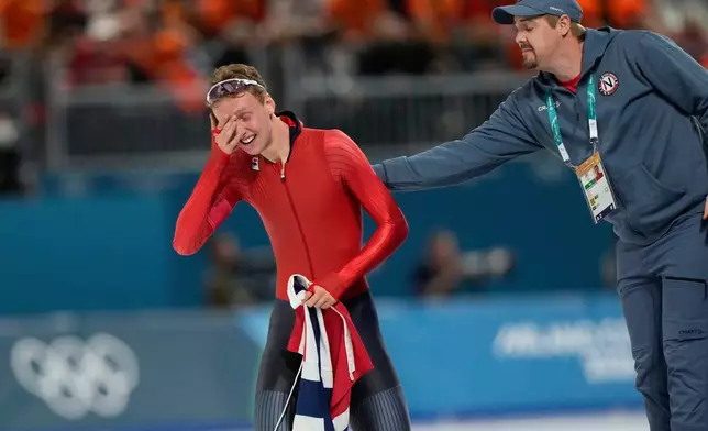 Sander Eitrem of Norway cries after winning a gold medal in the men's 5,000 meters speedskating race at the 2026 Winter Olympics, in Milan, Italy, Sunday, Feb. 8, 2026. (AP Photo/Luca Bruno)