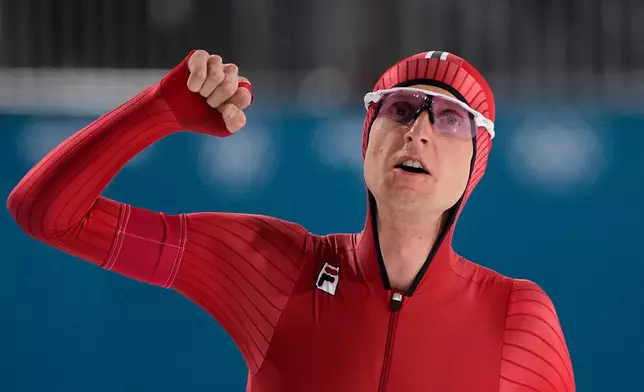 Sander Eitrem of Norway celebrates after the men's 5,000 meters speedskating race at the 2026 Winter Olympics, in Milan, Italy, Sunday, Feb. 8, 2026. (AP Photo/Ben Curtis)
