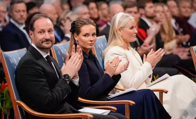 FILE -Norway's Crown Prince Haakon, Crown Princess Mette-Marit and Princess Ingrid Alexandra applaud during the Nobel Peace Prize award ceremony, in Oslo, Norway, Dec. 10, 2025. (Ole Berg-Rusten/NTB Scanpix, Pool via AP), File)