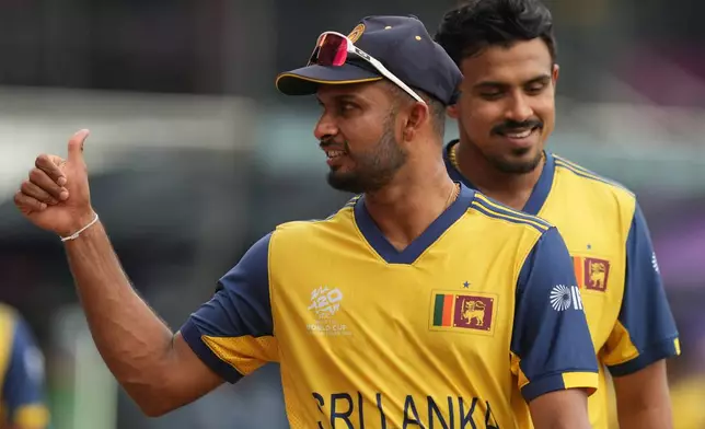Sri Lanka's captain Dasun Shanaka gives thumbs up to a fan during the T20 World Cup cricket match between Sri Lanka and Zimbabwe in Colombo, Sri Lanka, Thursday, Feb. 19, 2026. (AP Photo/Eranga Jayawardena)