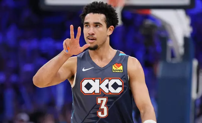 Oklahoma City Thunder guard Jared McCain reacts after making a basket during the second half of an NBA basketball game against the Brooklyn Nets, Friday, Feb. 20, 2026, in Oklahoma City. (AP Photo/Nate Billings)