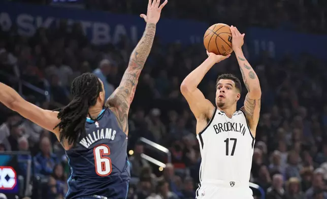 Brooklyn Nets forward Michael Porter Jr. (17) looks to shoot over Oklahoma City Thunder forward Jaylin Williams (6) during the first half of an NBA basketball game Friday, Feb. 20, 2026, in Oklahoma City. (AP Photo/Nate Billings)
