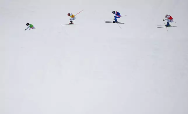 From left, Switzerland's Talina Gantenbein (5), Switzerland's Sixtine Cousin (13), France's Anouck Errard (12) and Switzerland's Saskja Lack (4) compete during the women's ski cross finals at the 2026 Winter Olympics, in Livigno, Italy, Friday, Feb. 20, 2026. (AP Photo/Julia Demaree Nikhinson)