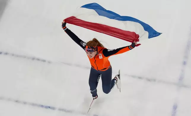 Netherlands' Antoinette Rijpma-de Jong celebrates after winning the women's speedskating 1,500-meters final at the 2026 Winter Olympics, in Milan, Italy, Friday, Feb. 20, 2026. (AP Photo/David J. Phillip)