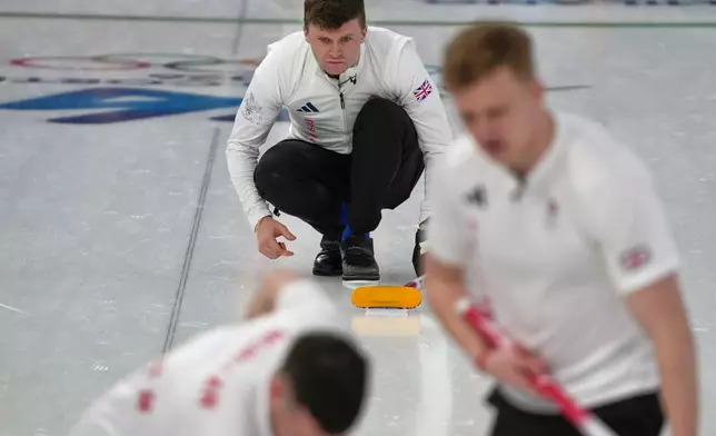 Britain's Bruce Mouat in action during the men's curling round robin session against the United States, at the 2026 Winter Olympics, in Cortina d'Ampezzo, Italy, Wednesday, Feb. 18, 2026. (AP Photo/Misper Apawu)