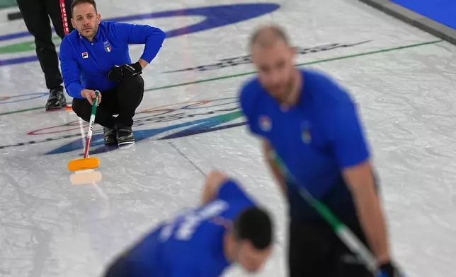 Italy's Joel Retornaz in action during the men's curling round robin session against Switzerland at the 2026 Winter Olympics, in Cortina d'Ampezzo, Italy, Thursday, Feb. 19, 2026. (AP Photo/Fatima Shbair)