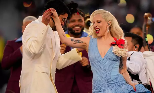 Bad Bunny and Lady Gaga perform during halftime of the NFL Super Bowl 60 football game between the New England Patriots and the Seattle Seahawks, Sunday, Feb. 8, 2026, in Santa Clara, Calif. (AP Photo/Brynn Anderson)