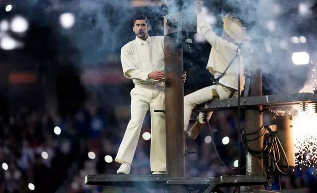 Bad Bunny performs during halftime of the NFL Super Bowl 60 football game between the New England Patriots and the Seattle Seahawks, Sunday, Feb. 8, 2026, in Santa Clara, Calif. (AP Photo/Brynn Anderson)