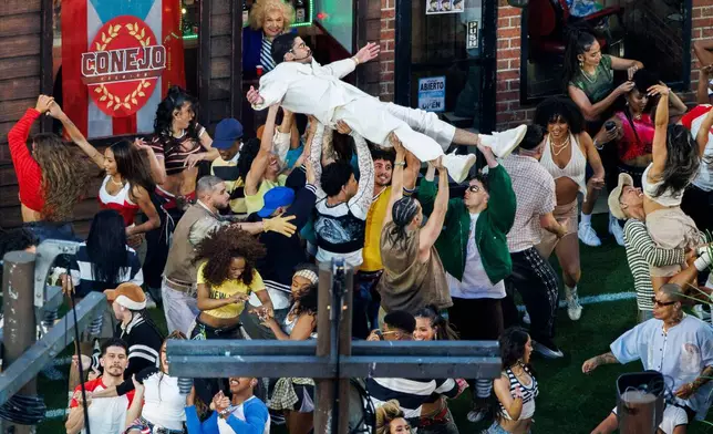 Bad Bunny, center top, performs during the halftime show of the NFL Super Bowl 60 football game between the Seattle Seahawks and the New England Patriots in Santa Clara, Calif., Sunday, Feb. 8, 2026. (Santiago Mejia/San Francisco Chronicle via AP)