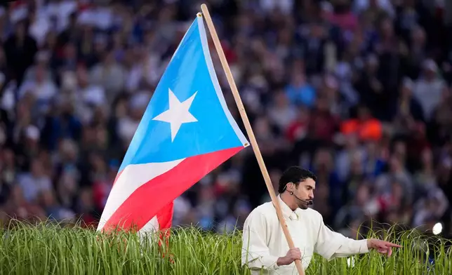 Bad Bunny performs during halftime of the NFL Super Bowl 60 football game between the New England Patriots and the Seattle Seahawks, Sunday, Feb. 8, 2026, in Santa Clara, Calif. (AP Photo/Mark J. Terrill)