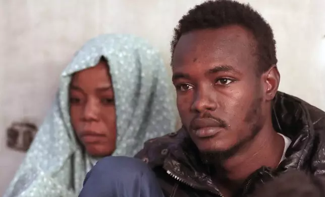 Mustafa Khater, a 28-year-old charity kitchen worker who fled with his pregnant wife a few days before el-Fasher fell to the RSF, sits at his his home in Cairo, Egypt, Wednesday, Jan. 14, 2026. (AP Photo/Khaled el Fiqi)