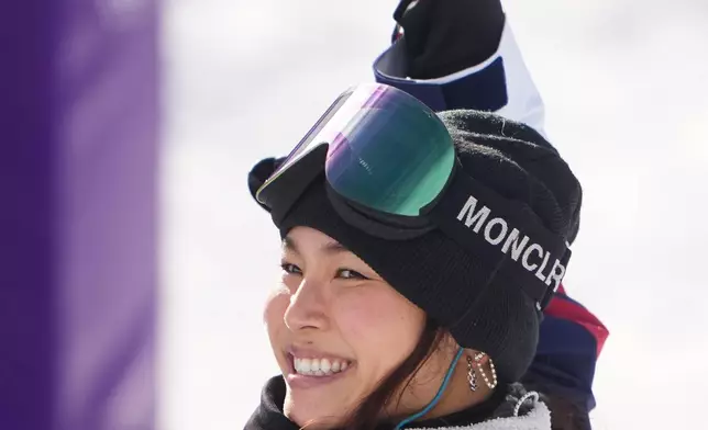 United States' Chloe Kim celebrates during the women's snowboarding halfpipe qualifications at the 2026 Winter Olympics, in Livigno, Italy, Wednesday, Feb. 11, 2026. (AP Photo/Lindsey Wasson)