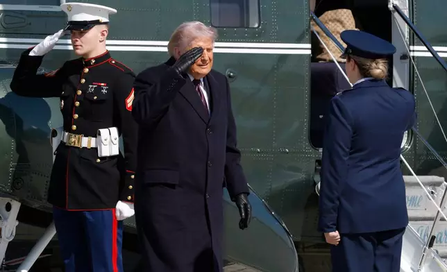 President Donald Trump, center, is greeted by Air Force 89th Air Wing Deputy Commander Melissa Dombrock, right, as he exits Marine One before boarding Air Force One, Friday, Feb. 27, 2025, at Joint Base Andrews, Md. (AP Photo/Luis M. Alvarez)