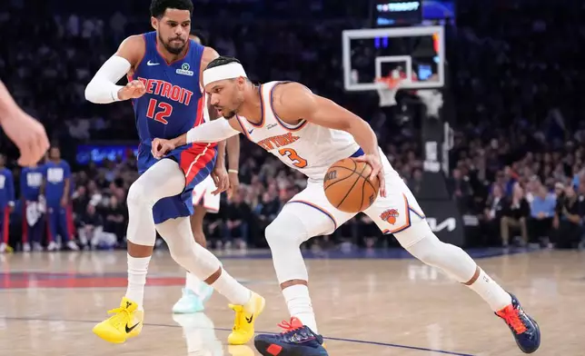 New York Knicks guard Josh Hart (3) drives past Detroit Pistons forward Tobias Harris (12) during the first half of an NBA basketball game, Thursday, Feb. 19, 2026, in New York. (AP Photo/Yuki Iwamura)