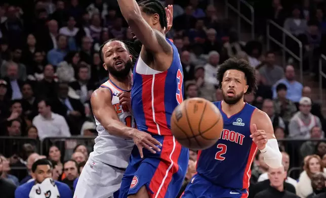 New York Knicks guard Jalen Brunson (11) passes during the first half of an NBA basketball game against the Detroit Pistons, Thursday, Feb. 19, 2026, in New York. (AP Photo/Yuki Iwamura)
