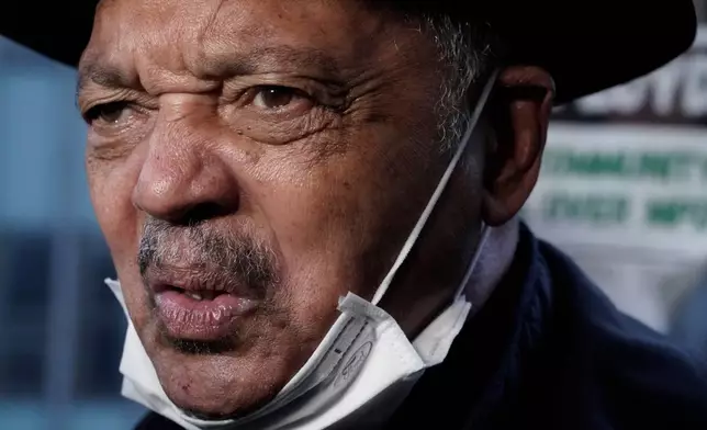 FILE - Rev. Jesse Jackson answers questions at a rally, April 19, 2021, in Minneapolis, as the murder trial against the former Minneapolis police Officer Derek Chauvin in the killing of George Floyd advances to jury deliberations. (AP Photo/Morry Gash, File)