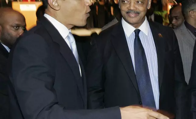 FILE - Democratic presidential hopeful Sen. Barack Obama, D-Ill., left, and the Rev. Jesse Jackson are seen at the Rev. Dr. Martin Luther King Jr. Scholarship Awards Breakfast in Chicago on Jan. 15, 2007. (AP Photo/Charles Rex Arbogast, File)