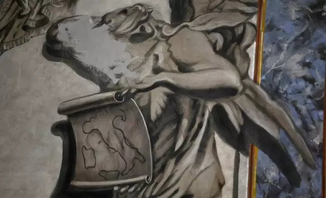 A painting inside the Basilica of San Lorenzo in Lucina in Rome depicting a cherub that bore a striking resemblance to Italian Premier Giorgia Meloni shows signs of alteration after the face was removed, Wednesday, Feb. 4, 2026. (Cecilia Fabiano/LaPresse via AP)