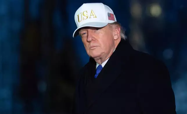 President Donald Trump walks on the South Lawn upon his arrival to the White House, Sunday, Feb. 1, 2026, in Washington. (AP Photo/Jose Luis Magana)