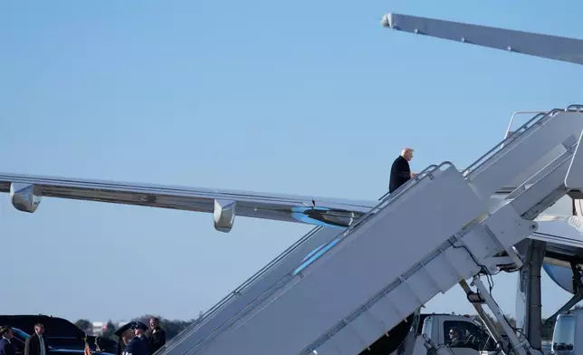 President Donald Trump boards Air Force One, Sunday, Feb. 1, 2026, at Palm Beach International Airport in West Palm Beach, Fla. (AP Photo/Mark Schiefelbein)