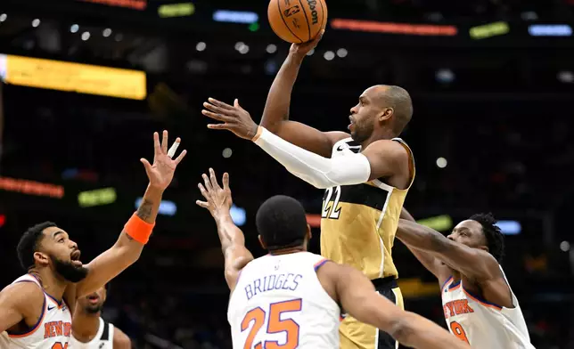 Washington Wizards forward Khris Middleton (22) goes to shoot during the first half of an NBA basketball game against the New York Knicks, Tuesday, Feb. 3, 2026, in Washington. (AP Photo/John McDonnell)