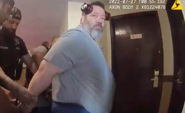 In this screengrab made from body camera footage provided by the Othello, Wash., Police Department, police officers arrest U.S. Immigration and Customs Enforcement supervisor Koby Williams in July 2022 during an underage sex sting operation. (Othello Police Department via AP)