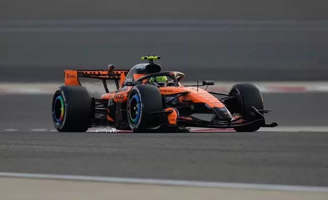McLaren driver Lando Norris of Britain steers his car during a Formula One pre-season test at the Bahrain International Circuit in Sakhir, Bahrain, Thursday, Feb. 12, 2026. (AP Photo/Altaf Qadri)