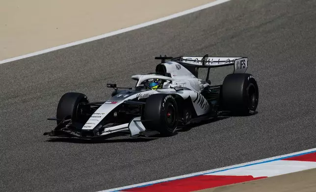 Cadillac driver Sergio Perez of Mexico steers his car during a Formula One pre-season test at the Bahrain International Circuit in Sakhir, Bahrain, Thursday, Feb. 12, 2026. (AP Photo/Altaf Qadri)