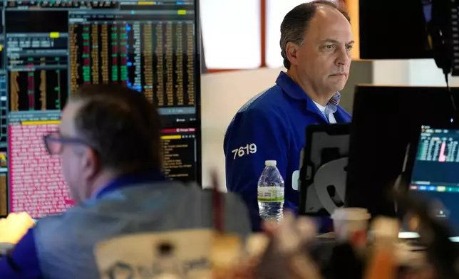 James Conti works on the floor at the New York Stock Exchange in New York, Thursday, Feb. 12, 2026. (AP Photo/Seth Wenig)