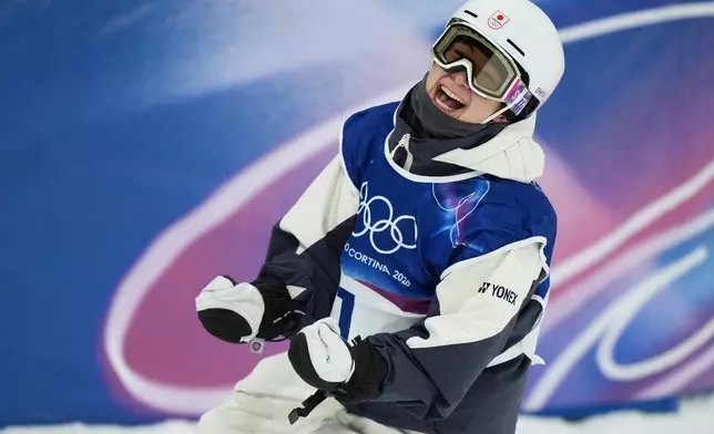 Japan's Yuto Totsuka celebrates during the men's snowboarding halfpipe finals at the 2026 Winter Olympics, in Livigno, Italy, Friday, Feb. 13, 2026. (AP Photo/Julia Demaree Nikhinson)