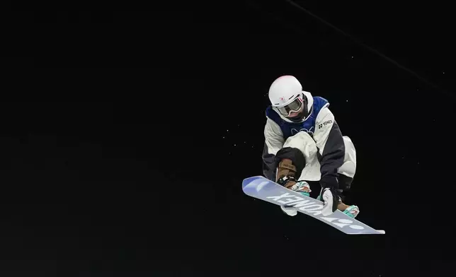 Japan's Yuto Totsuka competes during the men's snowboarding halfpipe finals at the 2026 Winter Olympics, in Livigno, Italy, Friday, Feb. 13, 2026. (AP Photo/Lindsey Wasson)