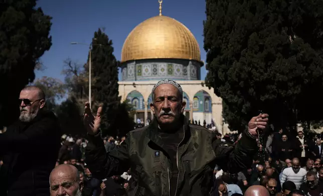 Muslim worshippers offer prayer on the first Friday of the holy month of Ramadan at the Al-Aqsa Mosque compound in Jerusalem's Old City, Friday, Feb. 20, 2026. (AP Photo/Mahmoud Illean)