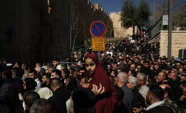 Muslim worshippers make their way to the Al-Aqsa Mosque compound during the holy month of Ramadan, in the Old City of Jerusalem, Friday, Feb. 20, 2026. (AP Photo/Leo Correa)